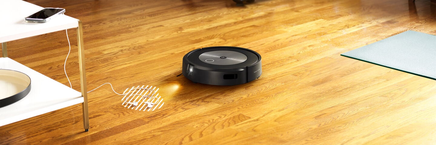 A Roomba detecting shoes on the floor